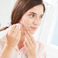 hover-image?Woman using Personal Microderm Classic in blush to do an at home microdermabrasion treatment