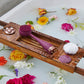 AT-4003-EBerry?Berry PMD Clean Body on bath tray surrounded by flowers