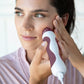 1001-berry?Woman using Personal Microderm Classic in berry to do an at home microdermabrasion treatment