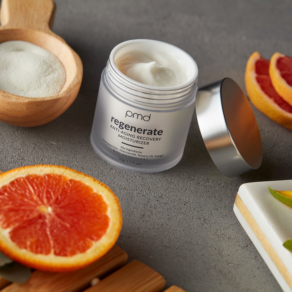 1023-N?closeup of 1023-N?regenerate Anti-Aging Recovery Moisturizer with oranges and collagen in background